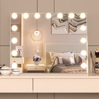 LED bulbs on Hollywood mirror frame close-up — warm daylight and cool white modes