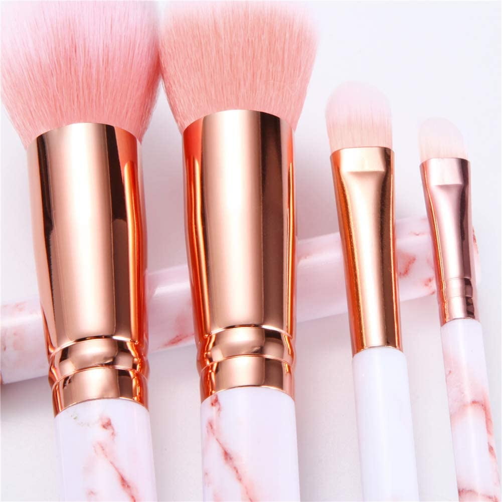 Pink marble brushes standing in holder — 16-piece set organized upright on vanity