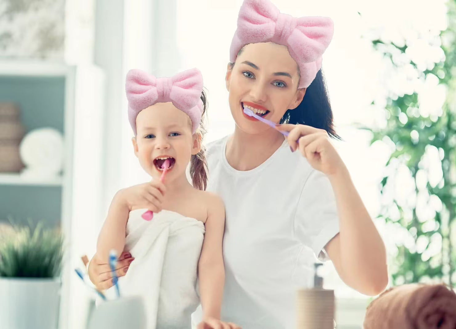 Spa headband worn during skincare routine — soft elastic bow keeps hair back