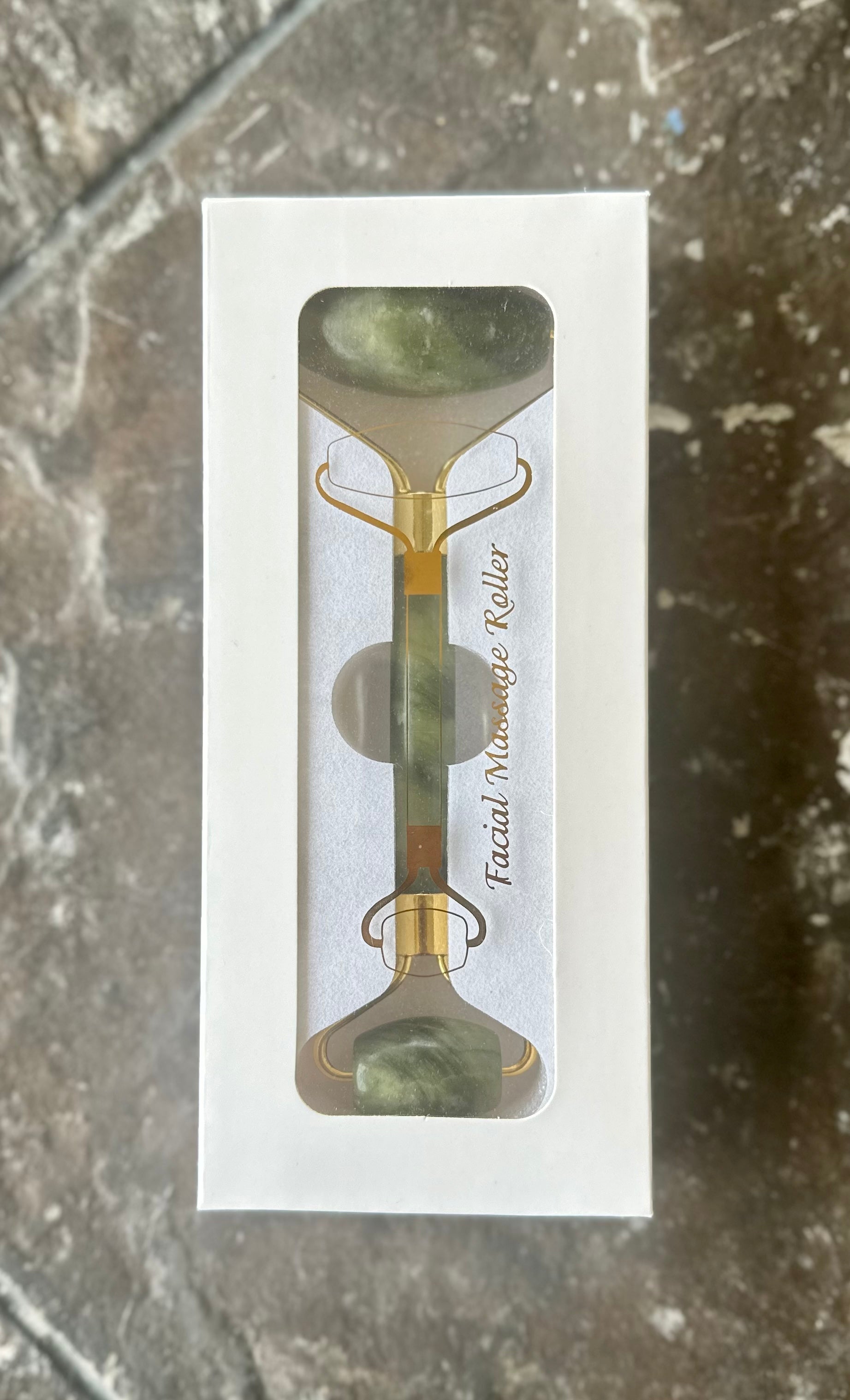 Jade Roller used on cheek — lymphatic drainage and de-puffing massage motion